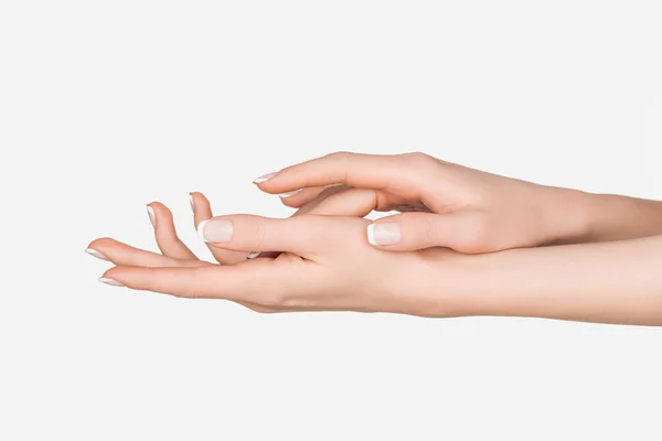 Vue recadrée des mains féminines isolées sur blanc — Photo de stock