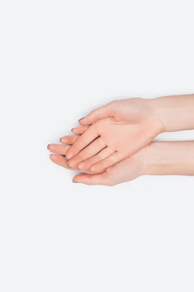 Vista superior de mãos femininas isoladas em branco com espaço de cópia — Fotografia de Stock