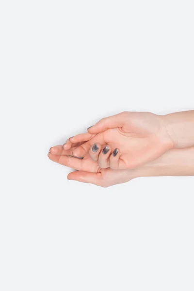 Vista dall'alto di mani femminili isolate su bianco con spazio copia — Foto stock