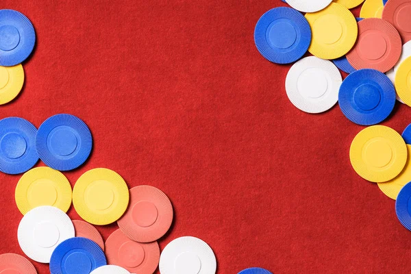 Top view of red poker table with multicolored chips — Stock Photo