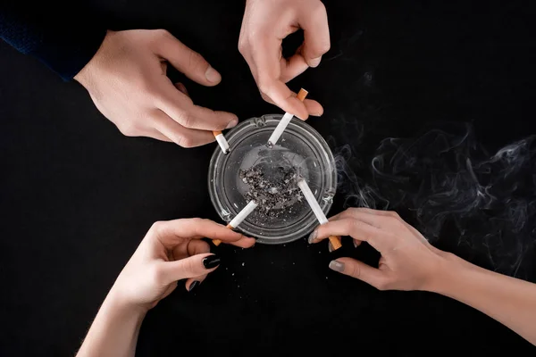 Top view of smoking people holding cigarettes — Stock Photo