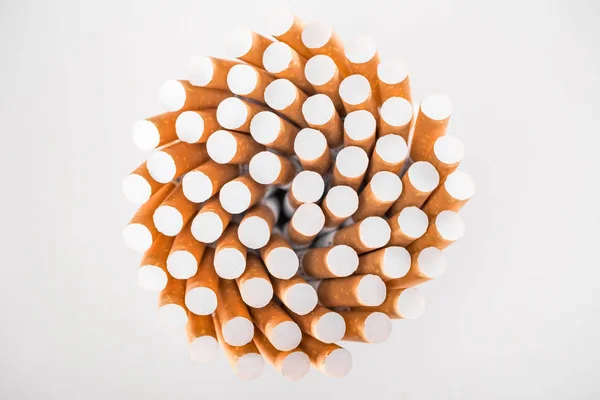 Flat lay with bunch of cigarettes isolated on grey — Stock Photo