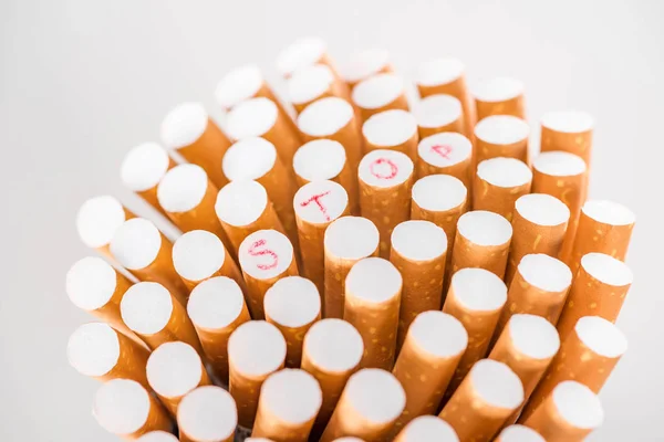 Studio shot of bunch of cigarettes isolated on grey, stop smoking concept — Stock Photo