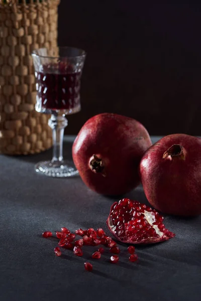 Studio shot of vintage wineglass and pomegranates — Stock Photo