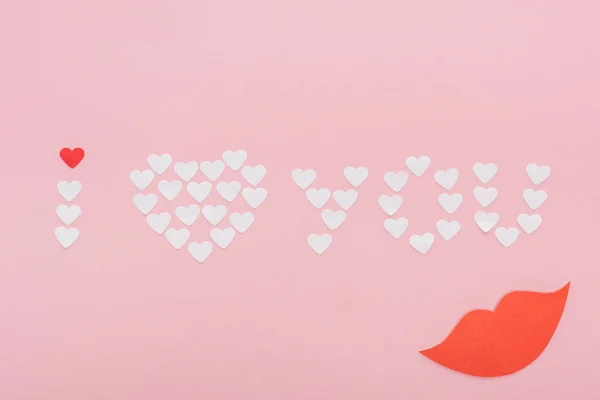 Top view of 'i love you' lettering made of paper hearts isolated on pink, st valentines day concept — Stock Photo