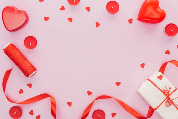 Top view of paper hearts and valentine decorations isolated on pink with copy space, st valentines day concept — Stock Photo