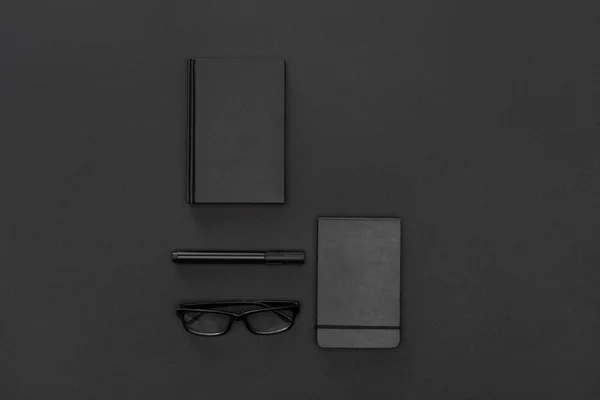 Top view of notebooks, pen and glasses — Stock Photo
