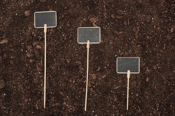 Top view of blank placards on ground, protecting nature concept — Stock Photo