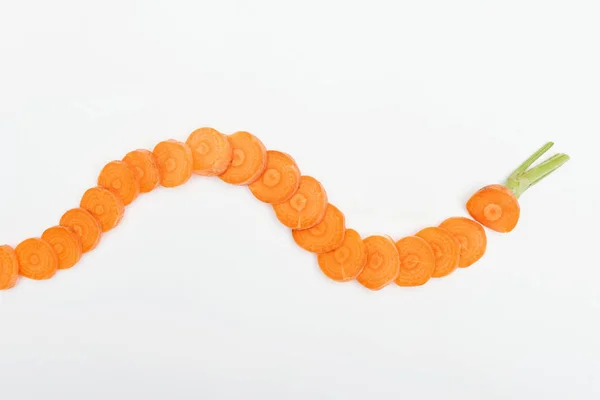 Top view of ripe raw carrot slices arranged in horizontal curved line isolated on white — Stock Photo