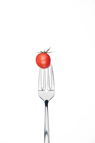 Fresh red whole cherry tomato on fork isolated on white — Stock Photo