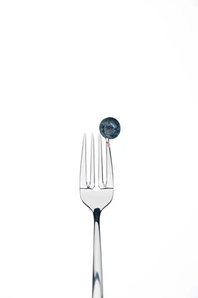 Fresh whole ripe blueberry on fork isolated on white — Stock Photo