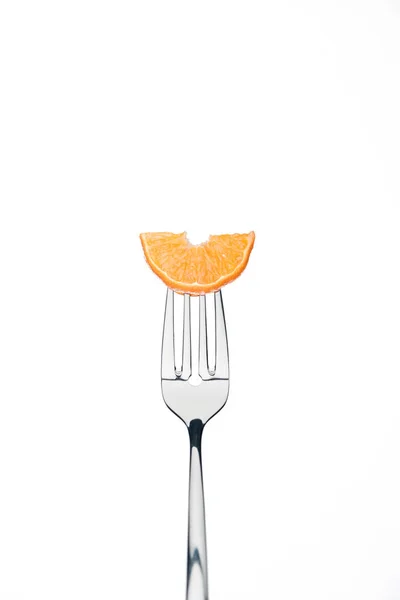 Slice of fresh ripe juicy tangerine on fork isolated on white — Stock Photo