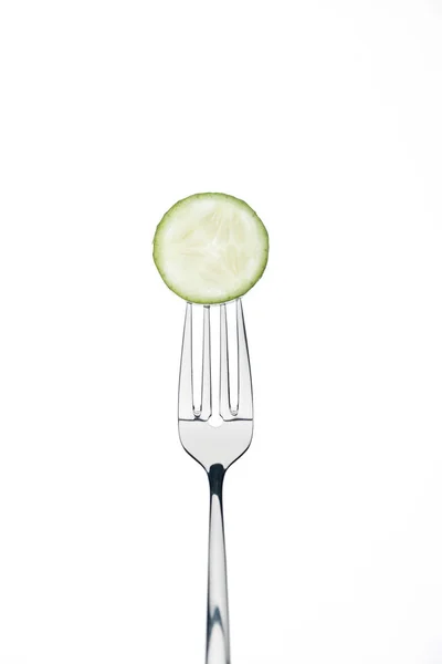 Circle slice of fresh ripe cucumber on fork isolated on white — Stock Photo