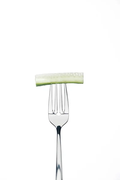 Long slice of fresh cucumber on fork isolated on white — Stock Photo