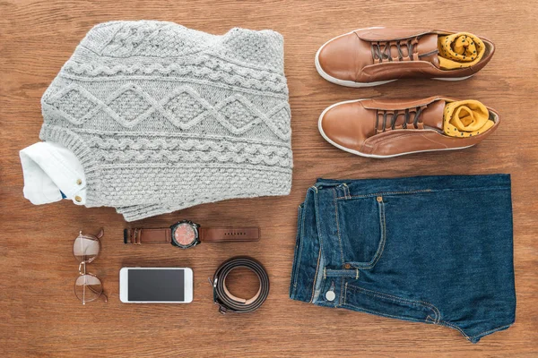 Flat lay with male clothes, shoes and accessories on wooden background — Stock Photo