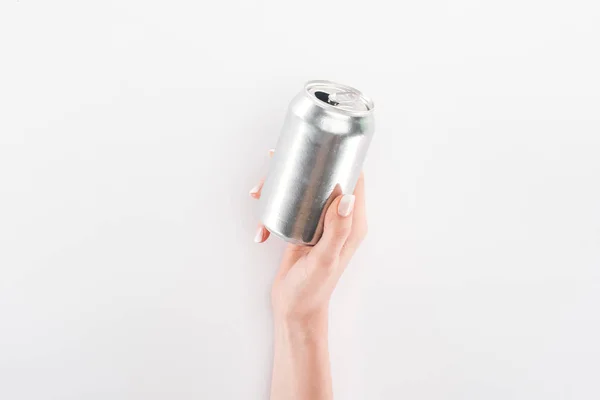 Partial view of woman holding empty can on grey background — Stock Photo