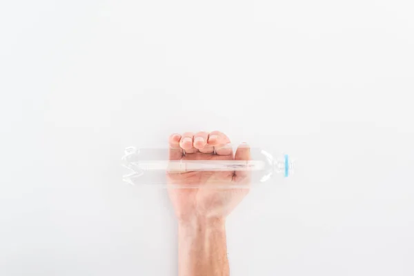 Partial view of man holding empty plastic bottle — Stock Photo