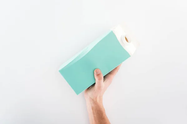 Partial view of man holding carton bottle on grey background — Stock Photo