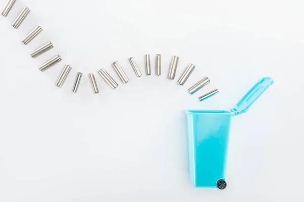 Top view of blue toy trashcan and batteries — Stock Photo