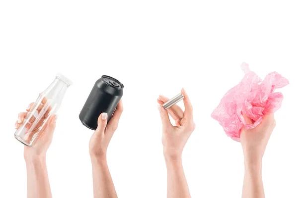 Collage de mains féminines avec bouteille en verre, boîte noire, batterie et sac en plastique rose isolé sur blanc — Photo de stock