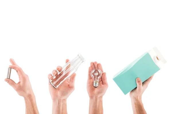 Collage of male hands with glass bottle, carton bottle, bulb and pink plastic bag isolated on white — Stock Photo