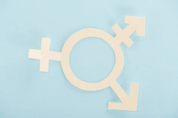 Papel blanco signo de género sobre fondo azul, concepto lgbt - foto de stock