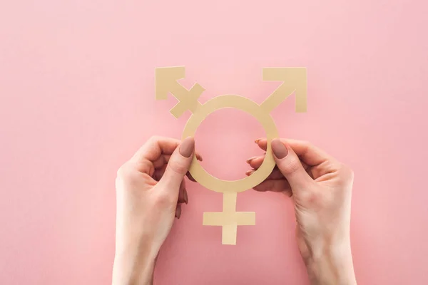 Partial view of woman holding gender sign on pink background, lgbt concept — Stock Photo