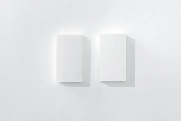 Top view of blank cards on white background with copy space — Stock Photo