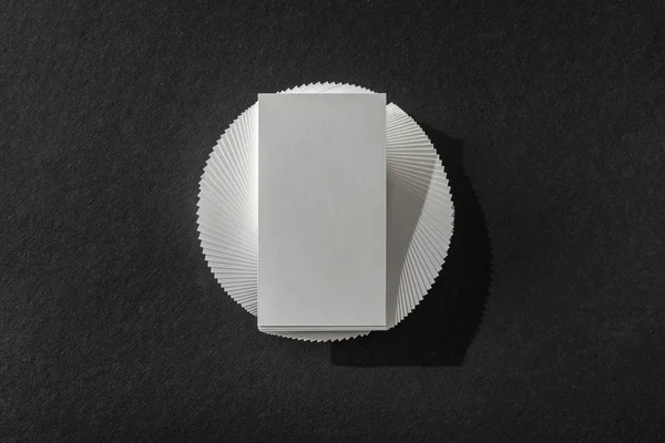 Top view of blank card on black table with copy space — Stock Photo