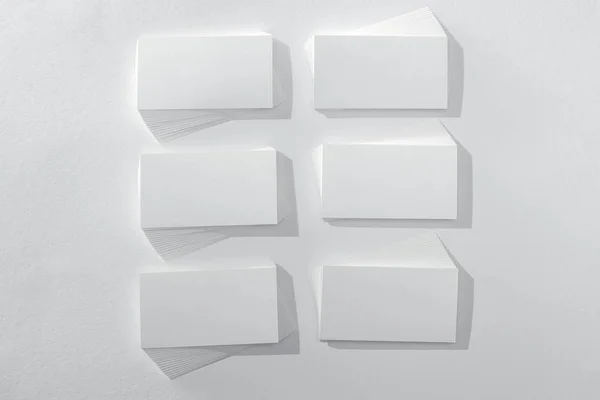 Top view of empty and blank cards on white background — Stock Photo