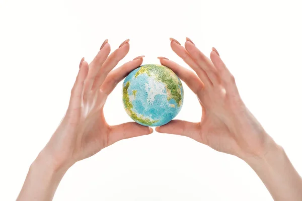 Partial view of woman holding earth model isolated on white, global warming concept — Stock Photo