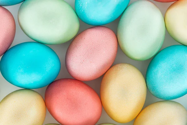 Top view of pastel easter eggs on grey — Stock Photo
