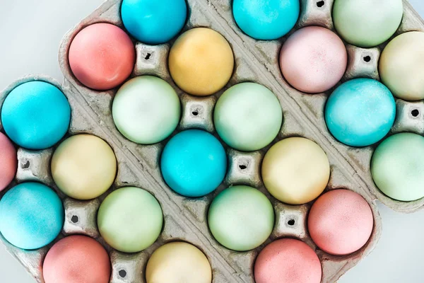 Top view of colorful easter eggs in paper containers — Stock Photo