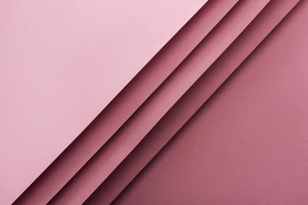 Top view of blank and empty sheets of paper on pink background with copy space — Stock Photo