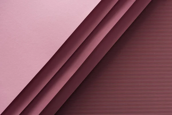 Top view of pink and empty sheets of paper on burgundy background — Stock Photo