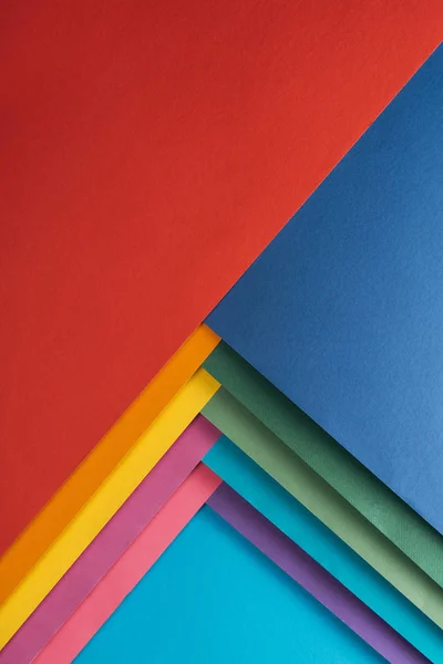 Vista superior de vermelho, azul, laranja, borgonha, verde, amarelo, rosa e roxo folhas de papel — Fotografia de Stock