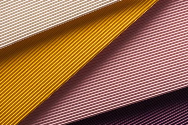 Top view of white, yellow, pink and purple papers with copy space — Stock Photo