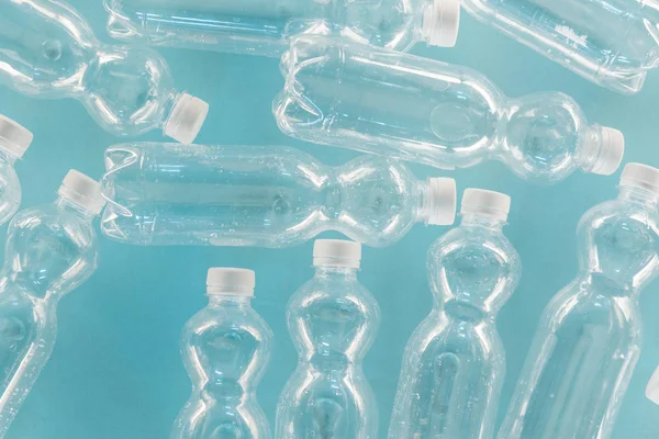 Top view of empty plastic bottles isolated on turquoise — Stock Photo