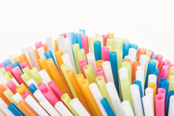 Selective focus of colorful and bright plastic tubes isolated on white with copy space — Stock Photo