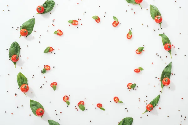 Flat lay with spices and sliced chili peppers with basil and ripe cherry tomatoes — Stock Photo