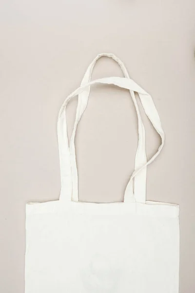 Top view of white cotton bag on grey surface — Stock Photo