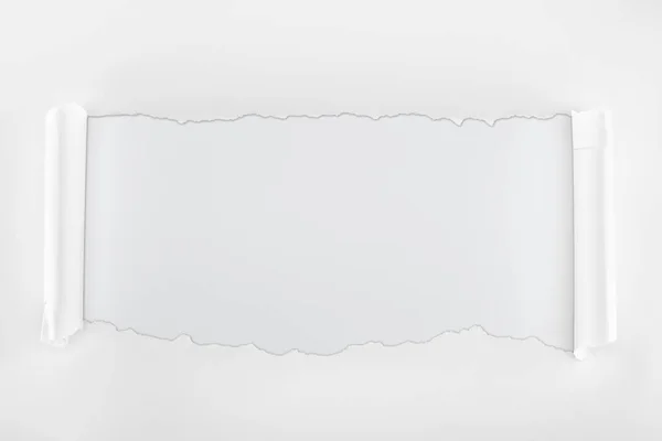 Ragged textured paper with curl edges on white background — Stock Photo