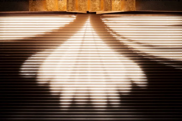 Sun rays and shadows on dark textured surface — Stock Photo