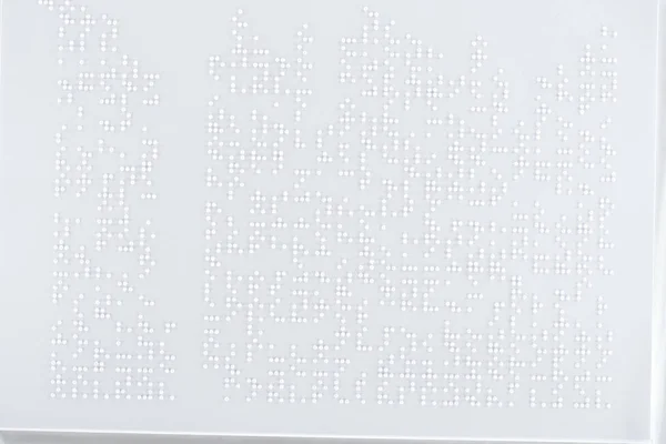 Fondo del texto en código braille internacional sobre papel blanco - foto de stock
