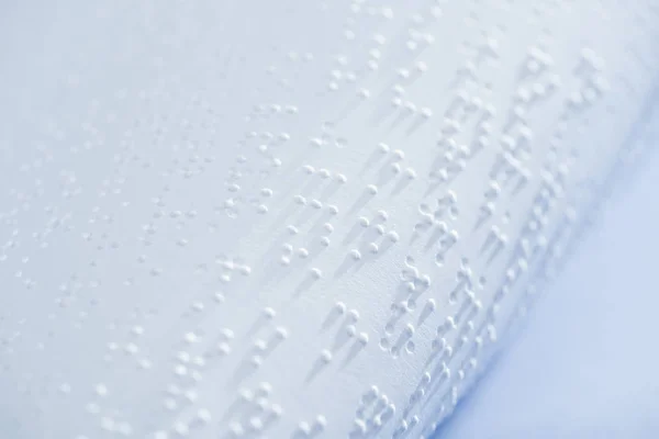 Selective focus of text in braille code on white paper with copy space — Stock Photo