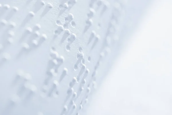 Selective focus of braille text on white paper with copy space — Stock Photo