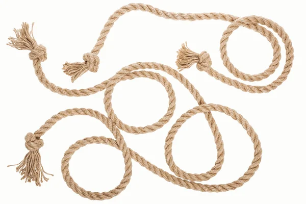 Brown jute ropes with curls and knots isolated on white — Stock Photo