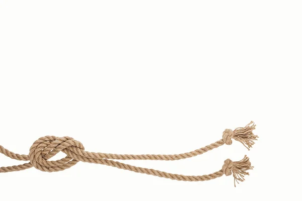 Nautical brown and twisted ropes with sea knot isolated on white — Stock Photo