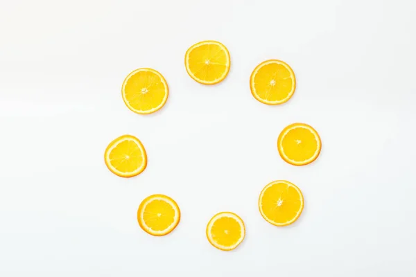 Flat lay with juicy cut fruits on white surface — Stock Photo