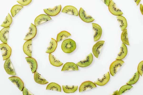 Flat lay with juicy cut kiwis on white surface — Stock Photo